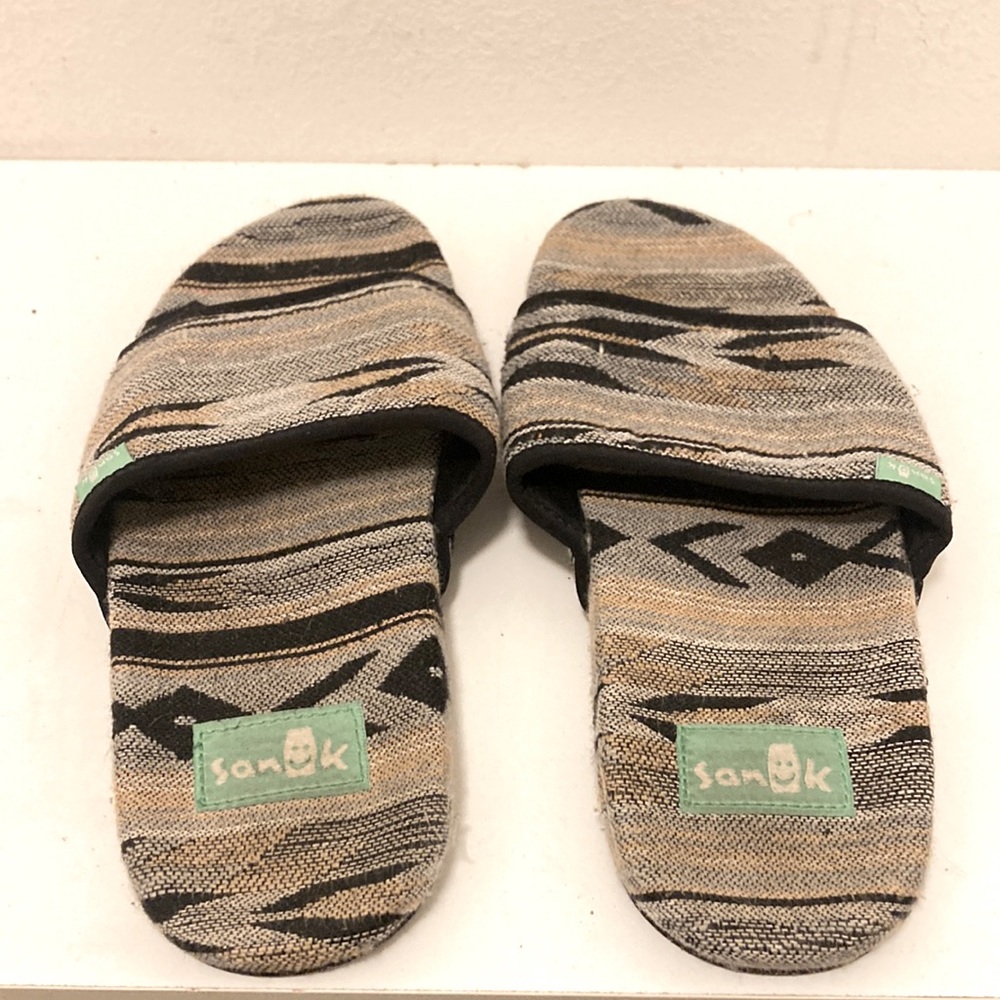 Size 7 woman’s US Sanuk slides.